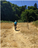 Person Riding Bike Through Trail on Greenway for a Day