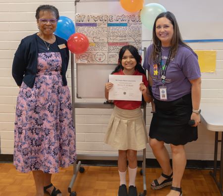From left: Mayor Denyse McGriff, Brittney Gil-Rosales and Principal Jacinta Ortiz.