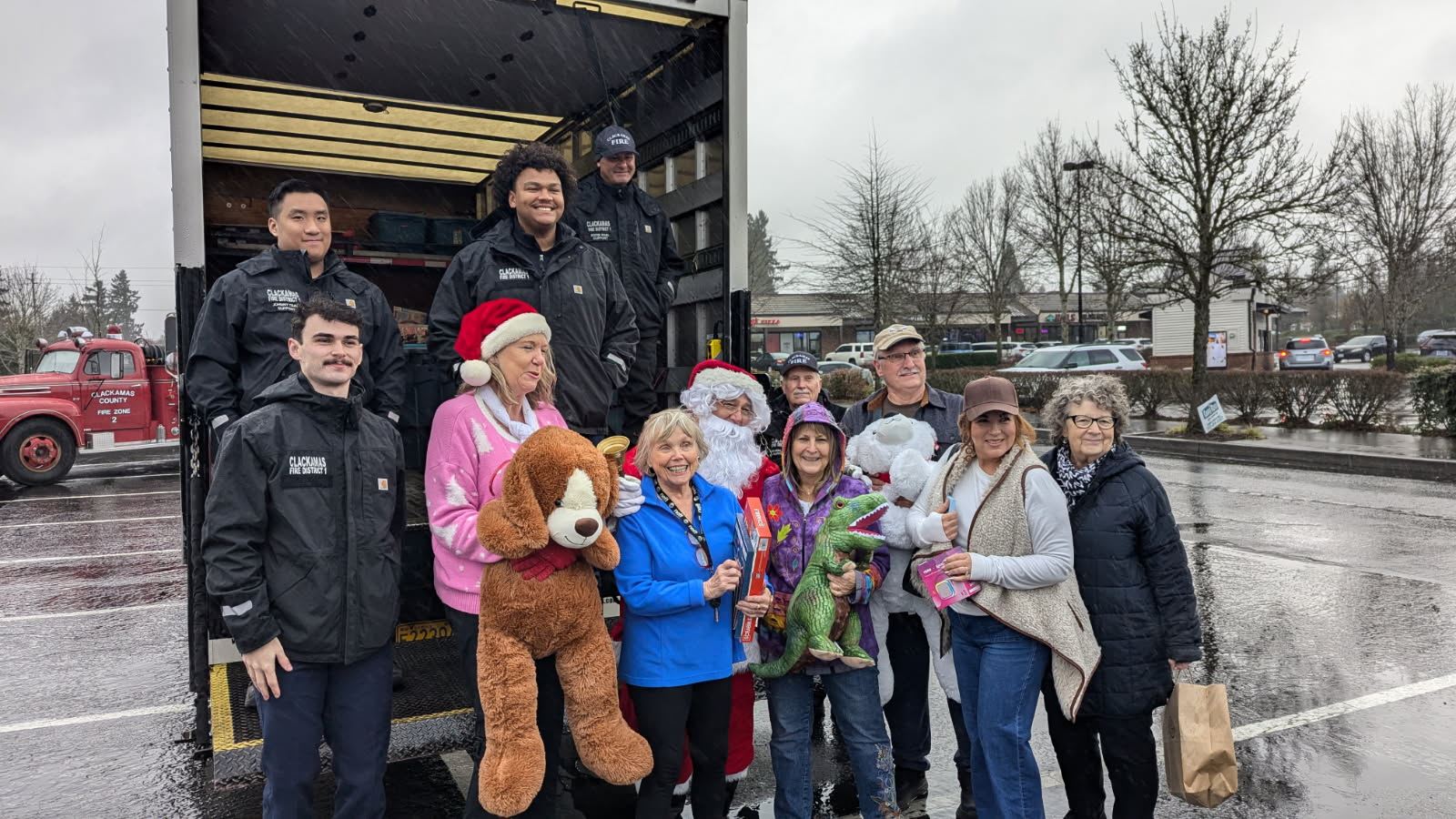 2025-12-062 Caufield Neighborhood Association donates to toy drive with Santa and Oregon City Police