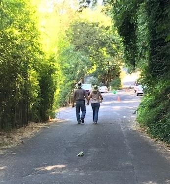 Couple Walking on a Trail for Greenway for a Day
