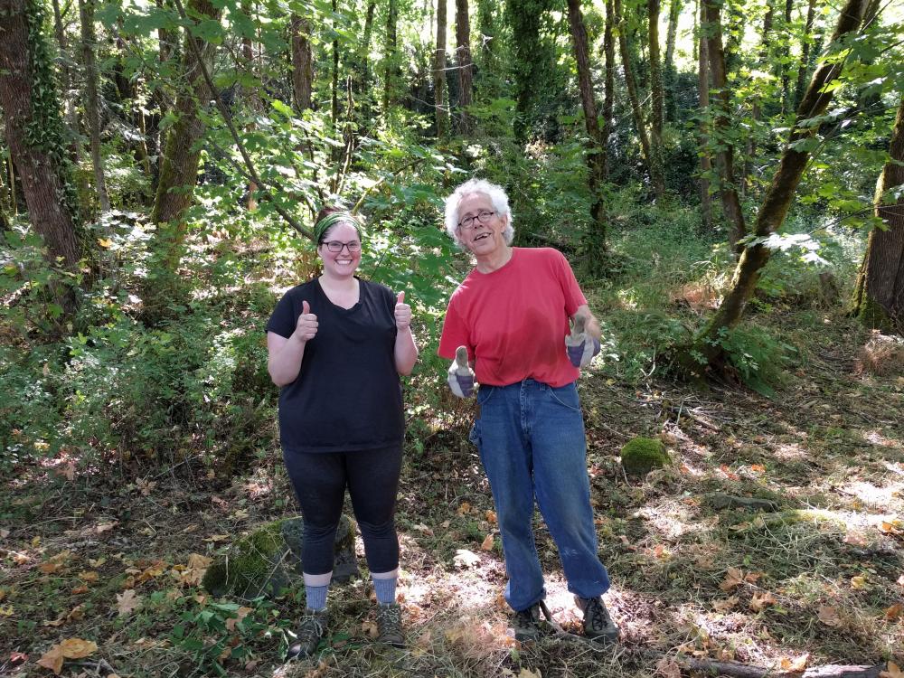 Greenway for a day - Two People Smiling and Participating in Ivy Pulling in Old Canemah Park