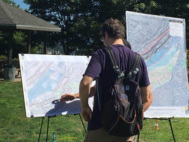 Two People Viewing Community Plans on Greenway for a Day