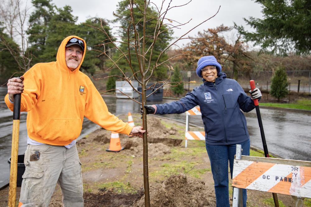 Mayor and John Planting a Tree